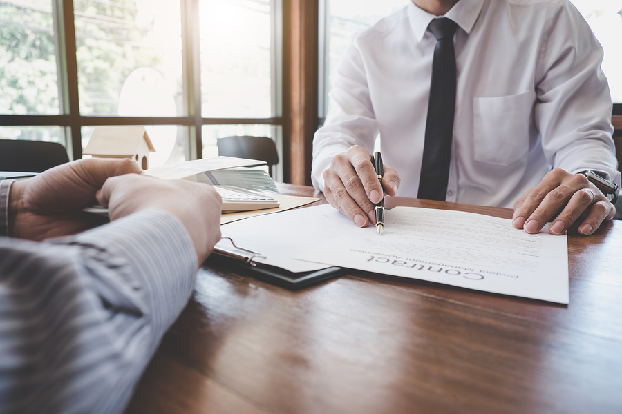bigstock-Business-Signing-A-Contract-Bu-281589442