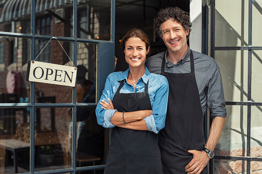 bigstock-Two-cheerful-small-business-ow-277396642