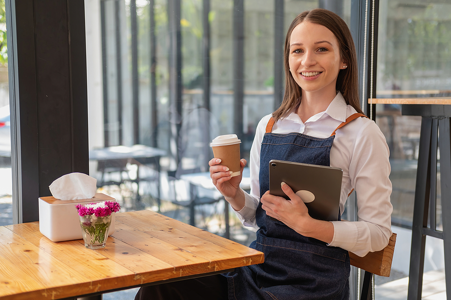 bigstock-Portrait-Of-A-Woman-A-Coffee-472852607